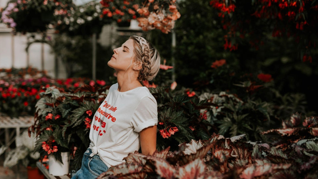 A girl smelling a field of flowers and strong memories