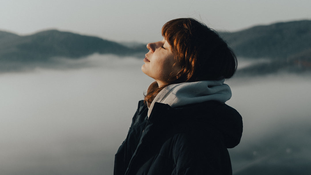 Woman outside breathing in winter fragrances