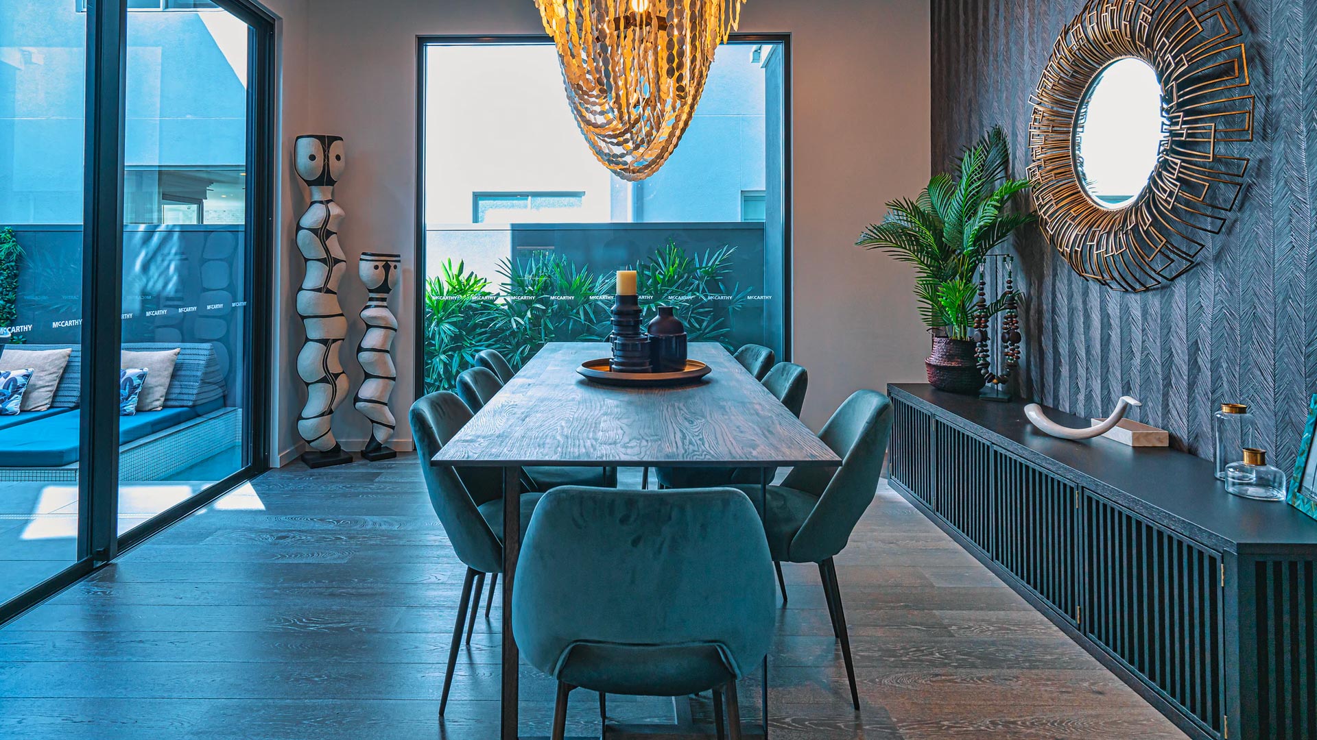 Spacious dining room and wooden dining table with candles in the centre