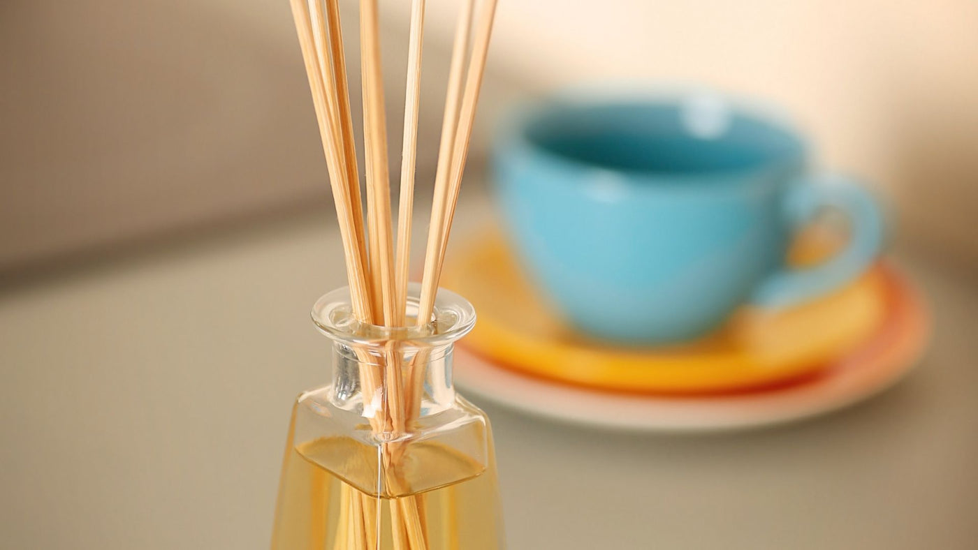 Fragrance diffuser in the kitchen next to a cup of tea