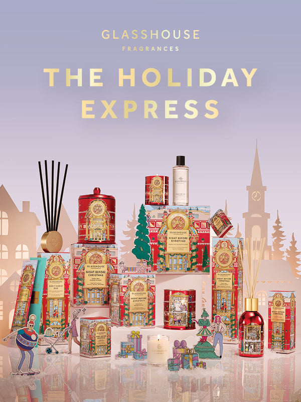 Collection of Glasshouse Fragrances products with 'The Holiday Express' branding on a cityscape background.